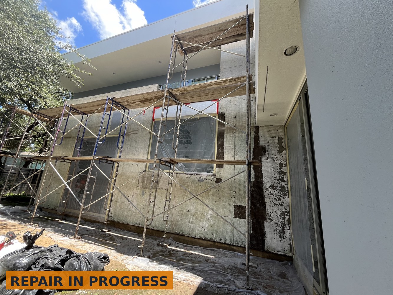 Exterior stucco and tile repair in progress